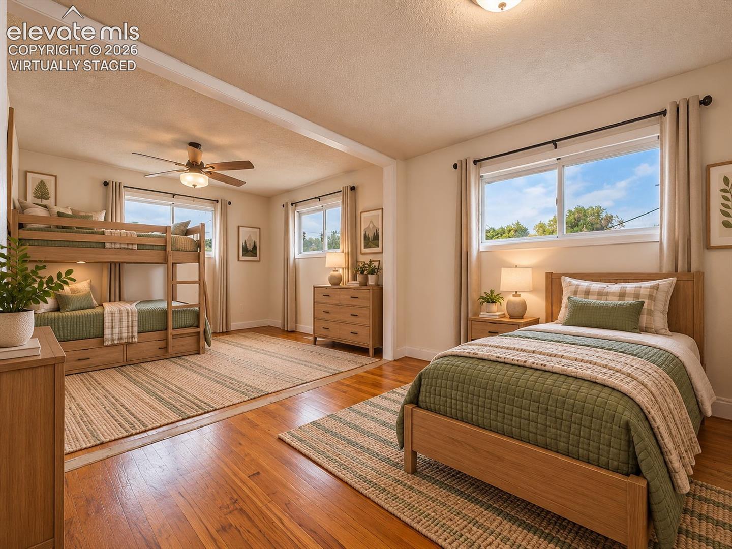(Virtually Staged)
Spacious, expanded bedroom showcasing the flexibility of two combined rooms, beautifully staged with bunk beds and a separate sleeping area. Virtually staged