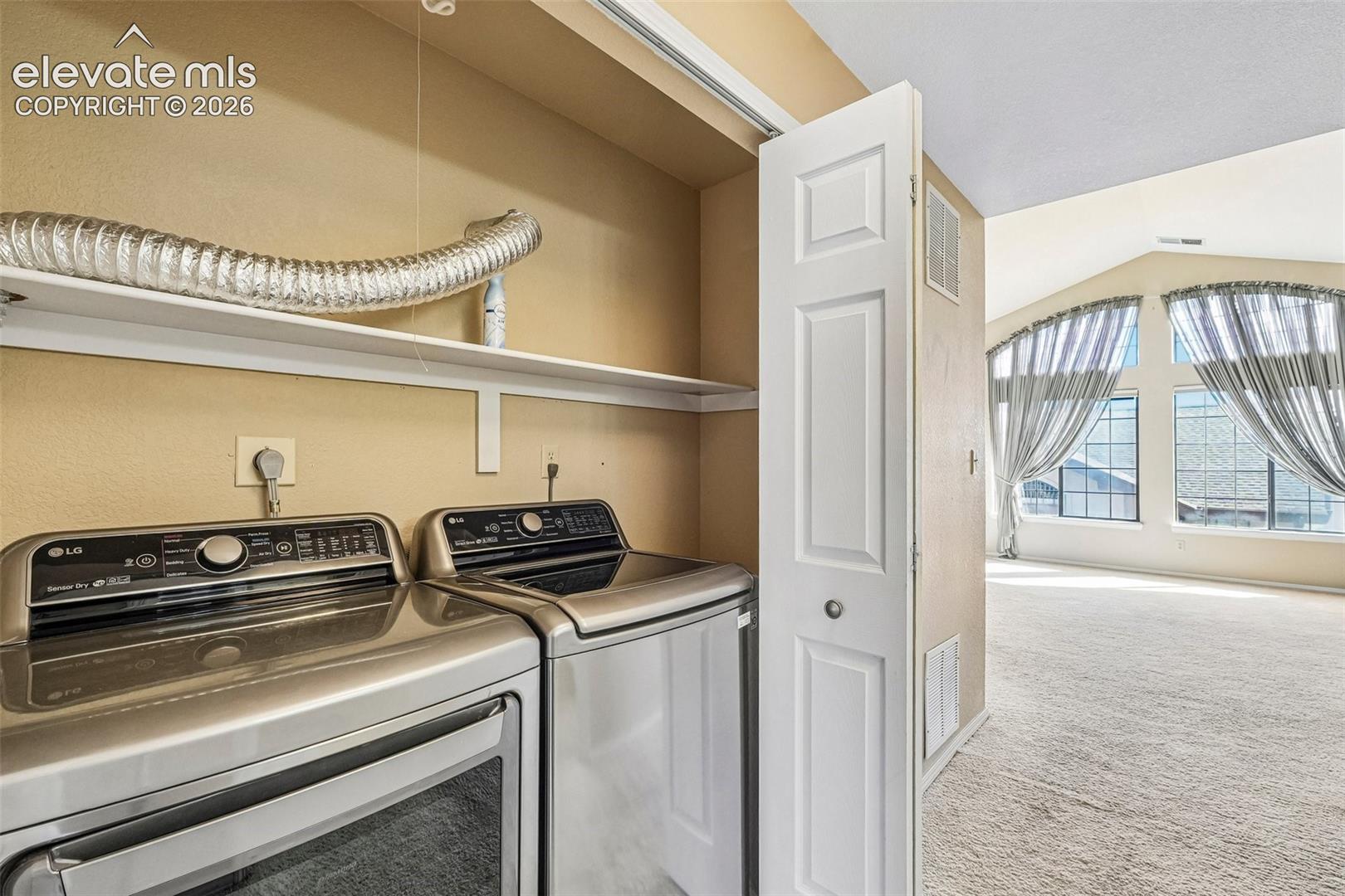 Conveniently located laundry between primary and bedroom 2