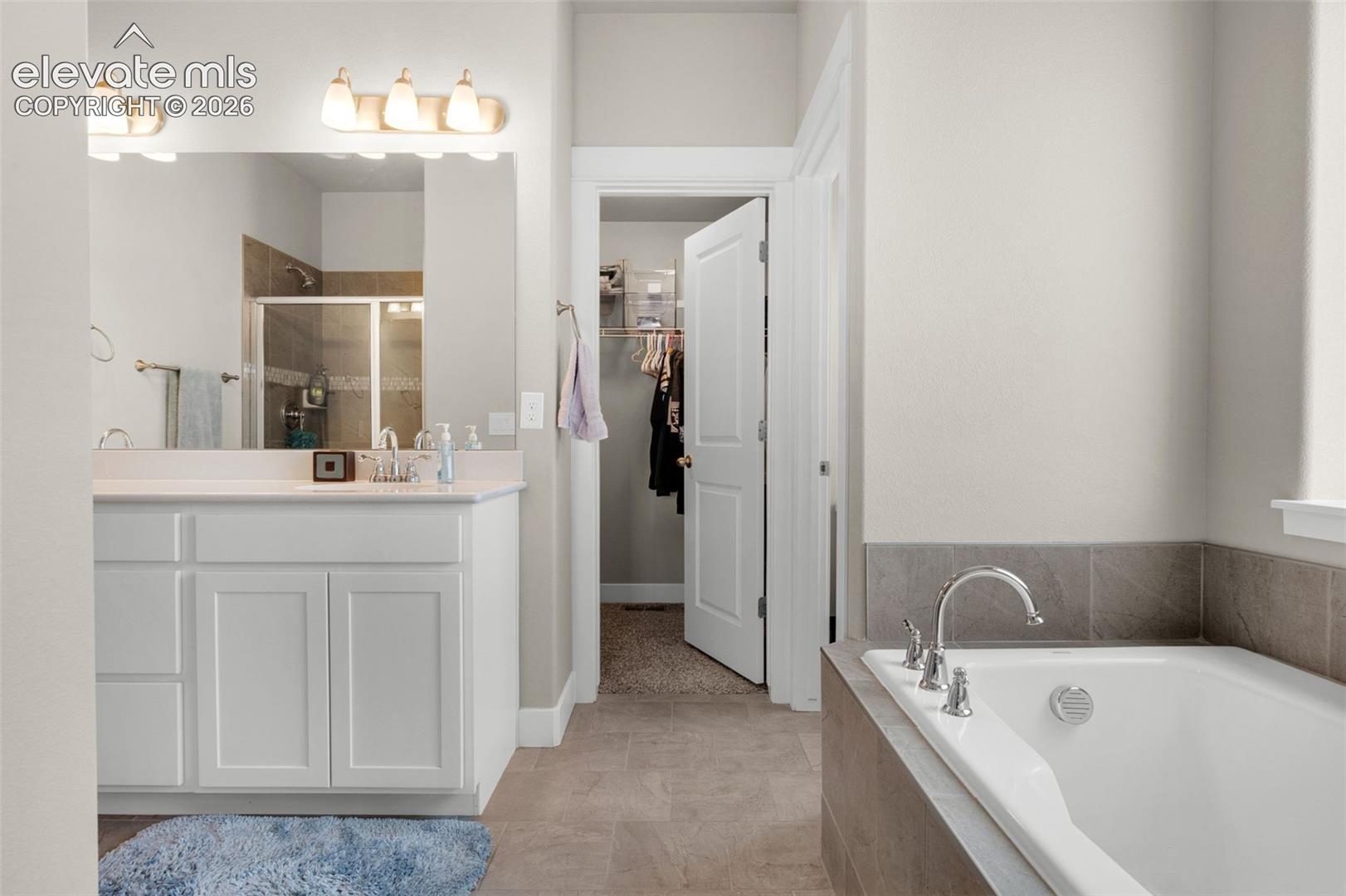 Lots of space in primary bath.  Walk-in closet is at far end