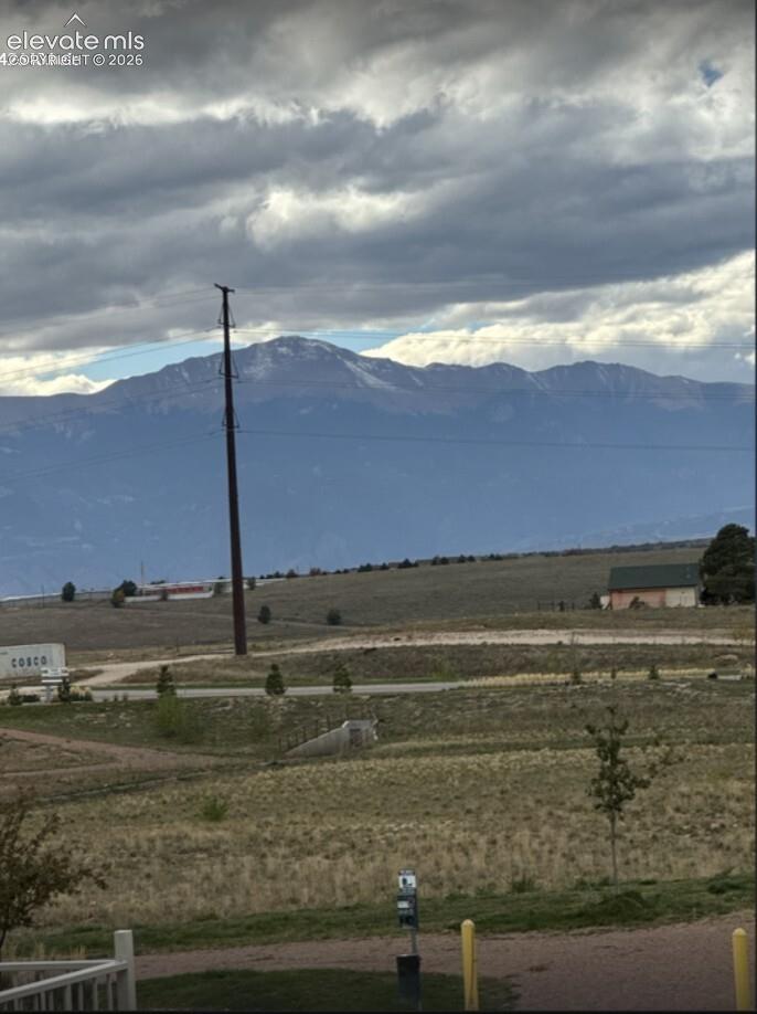 Expansive mountain landscape featuring rugged terrain and open horizon