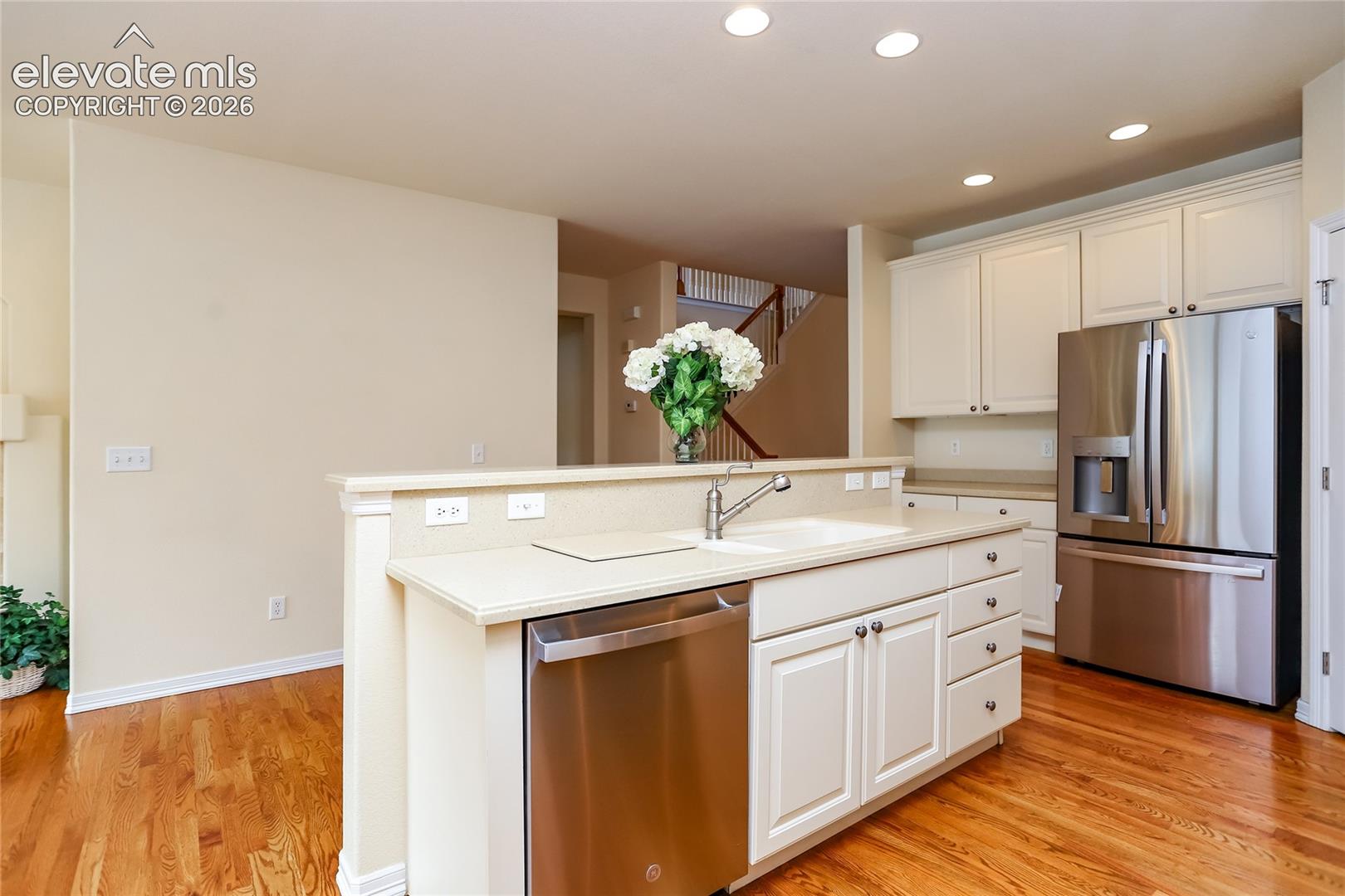 kitchen also offers solid surface counters and upgraded cabinets with pull-out shelving!