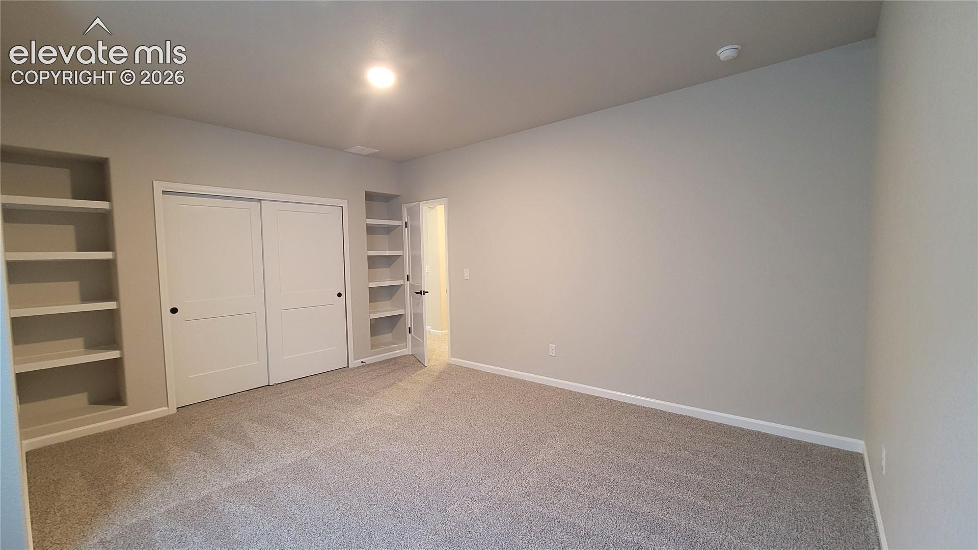 3rd Bedroom, with built-in shelving, located in the lower level! 