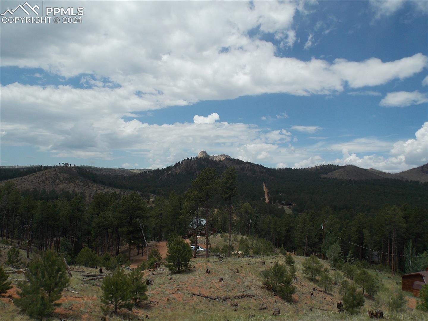 Build site with view of Sheeps Nose. Pine Lake is located just below the home pictured in the woods. 