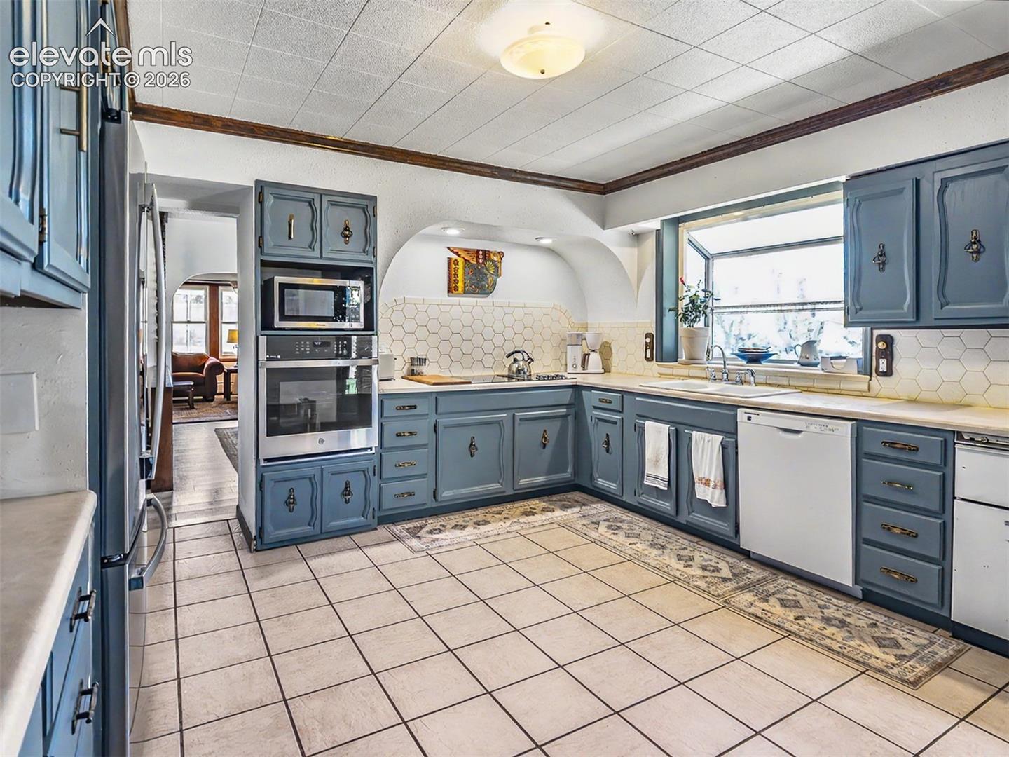 Architectural features of mid-century kitchen blended seamlessly with modern appliances