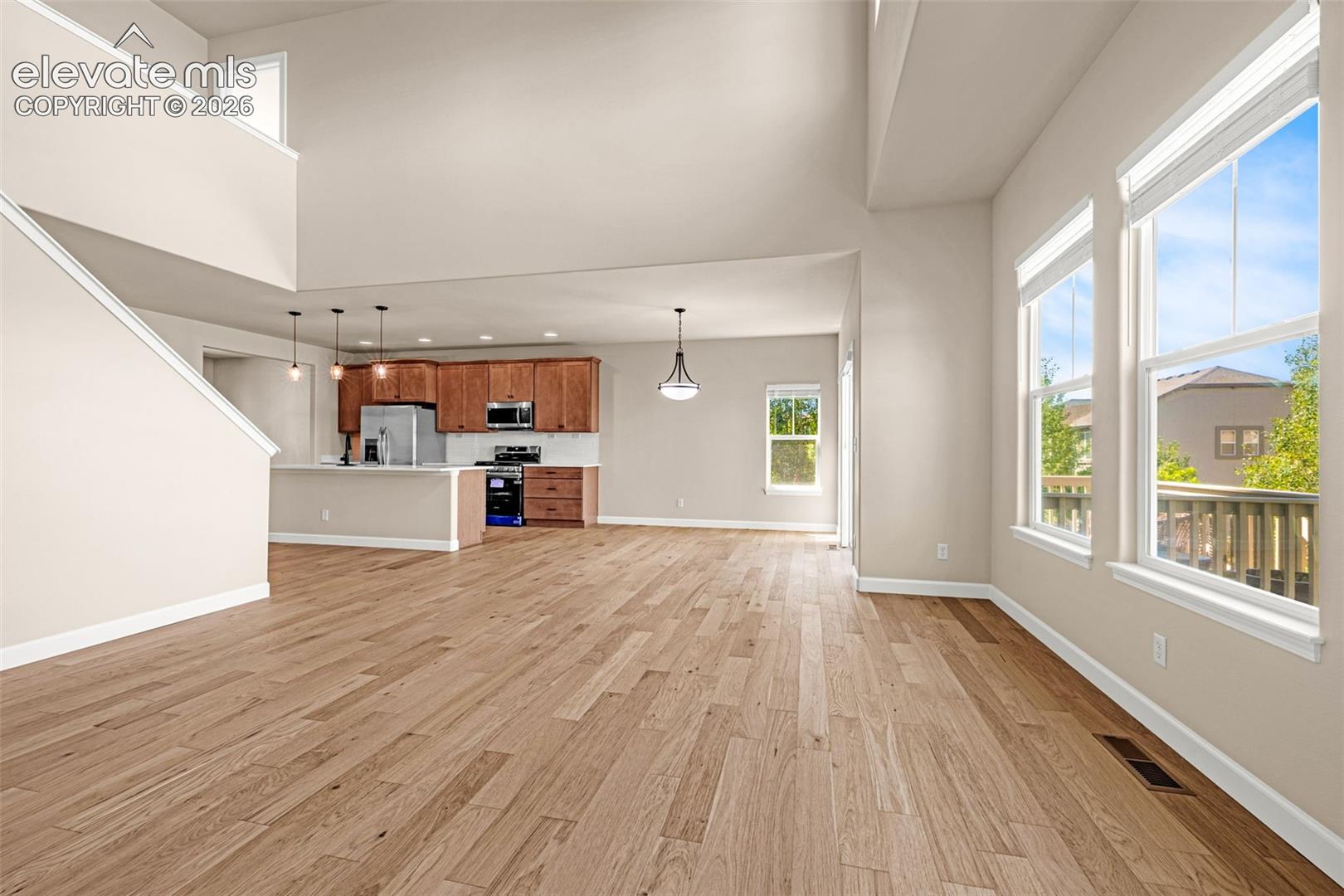 18 foot soaring ceilings brighten the space even more.  Open to the Kitchen and walk-out breakfast nook; keeps everyone included.