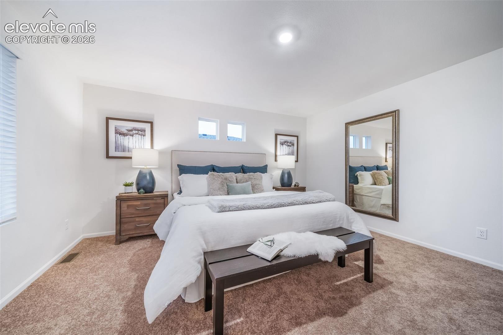 Recessed lighting, white walls, carpet flooring, window with blinds, and built-in wall niches
*photos of a model home*