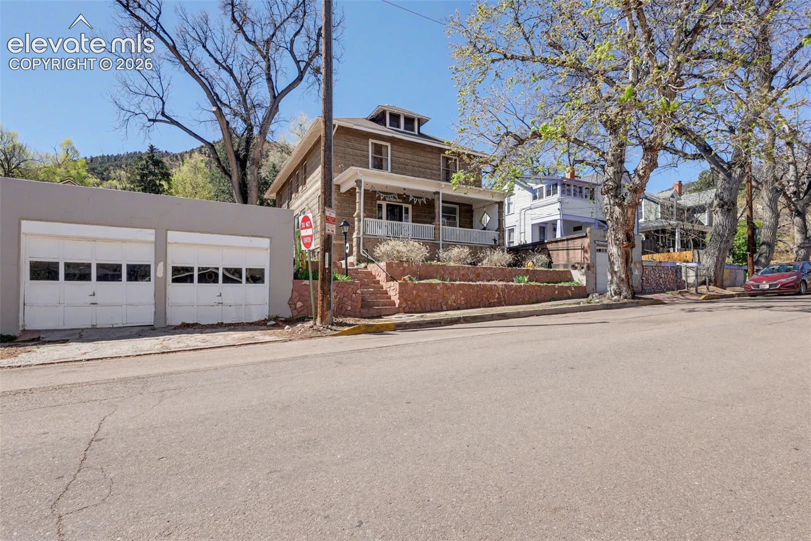 Front view of main home and 2 car detached garage