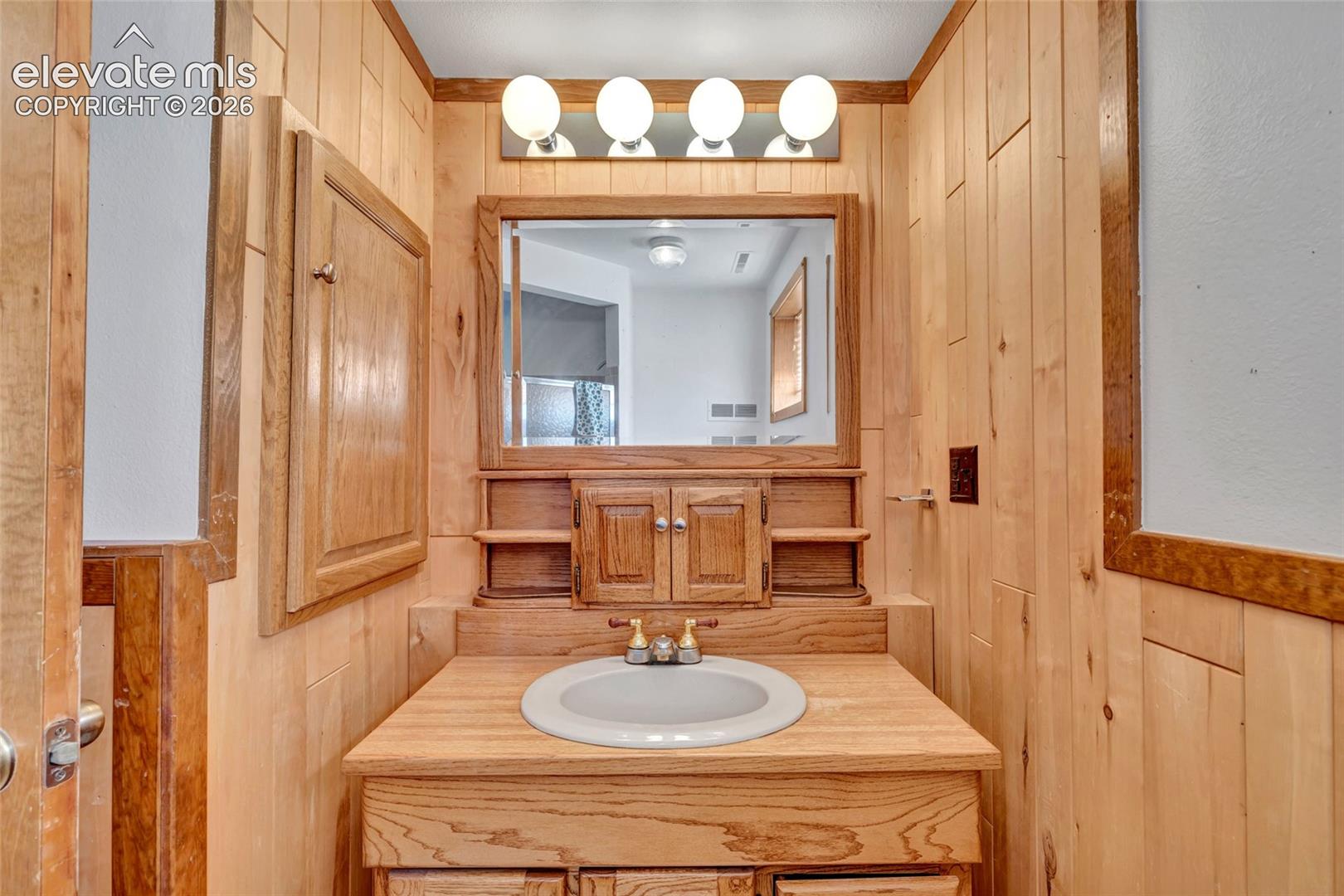 Wood-paneled walls and ceiling trim
