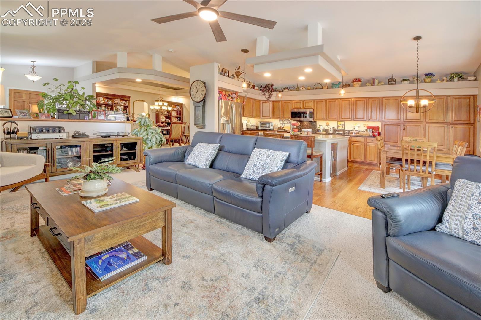 Living room has ceiling fan