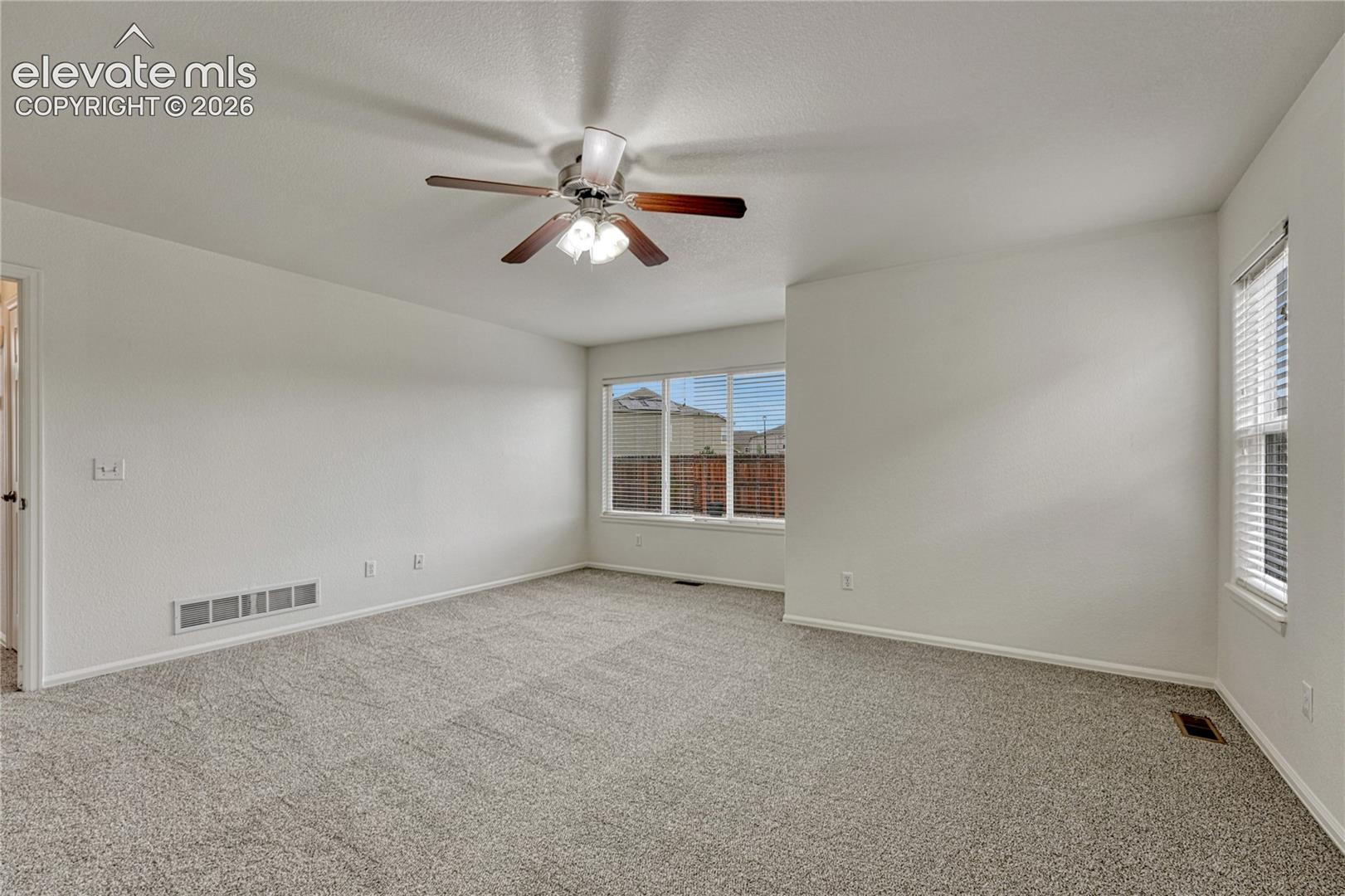 Primary bedroom with sitting area. 