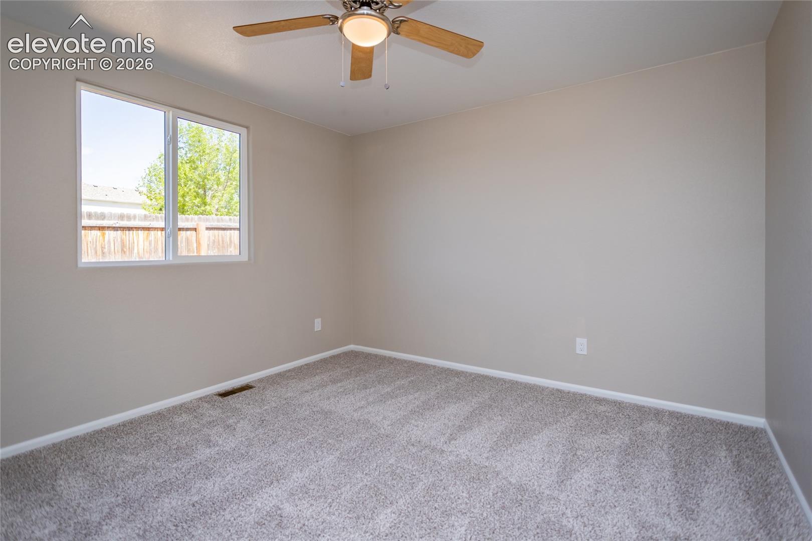Fresh paint, new carpet, lighted ceiling fan - nice secondary bedroom!
