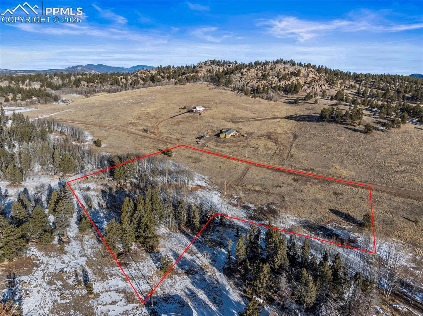 Overview of rural landscape with property parcel outlined and mountains. Property Lines are Approximate and not a survey.