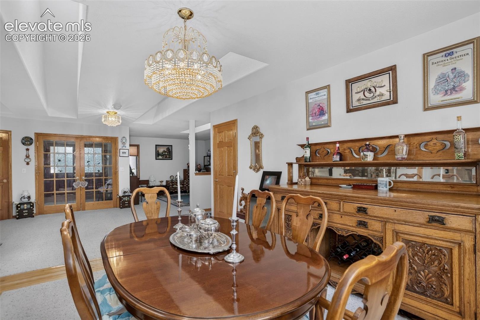Formal dining area with skylights and access to kitchen.