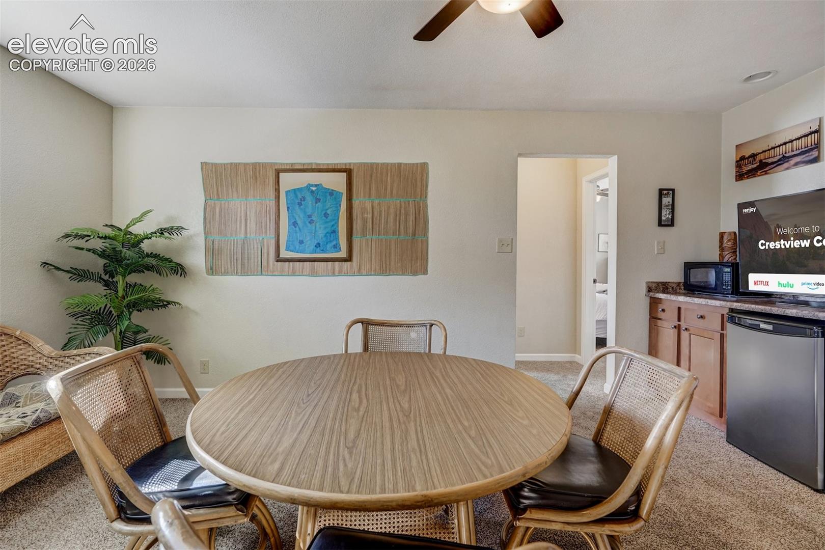 Built-in cabinetry with a countertop, recessed lighting, and a ceiling fan