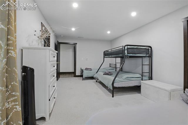 Bedroom featuring recessed lighting and light colored carpet