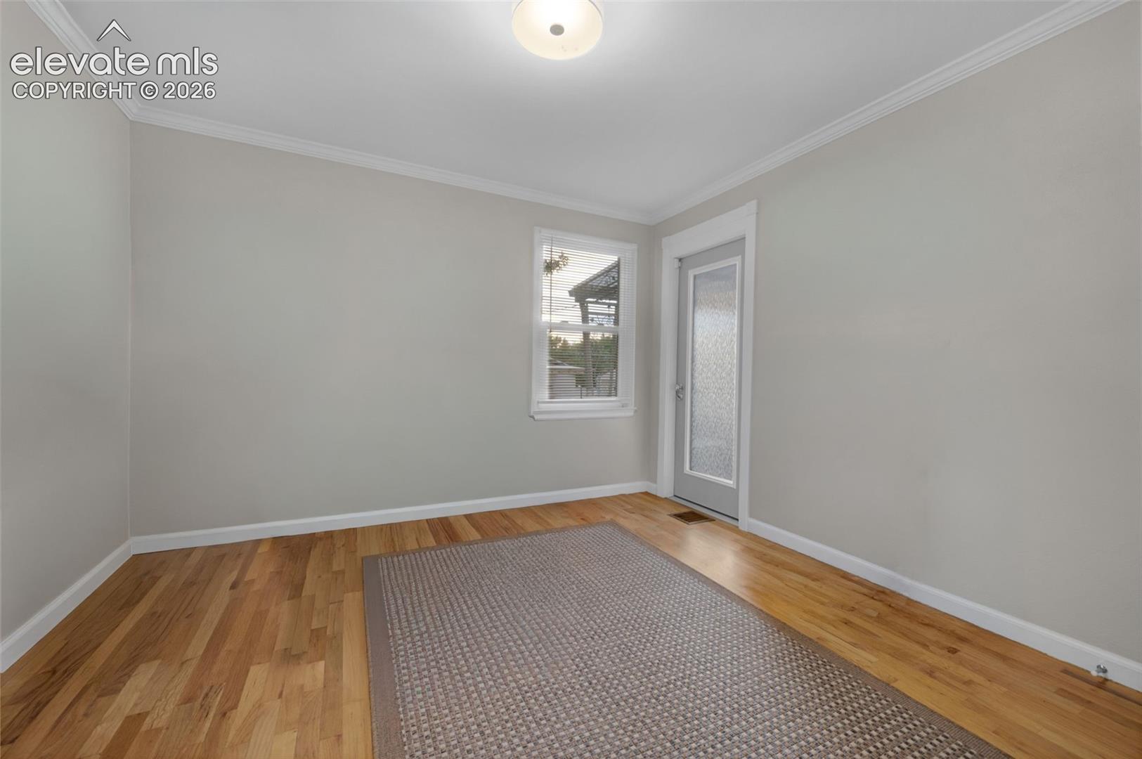 2nd bedroom upstairs with door to covered patio 