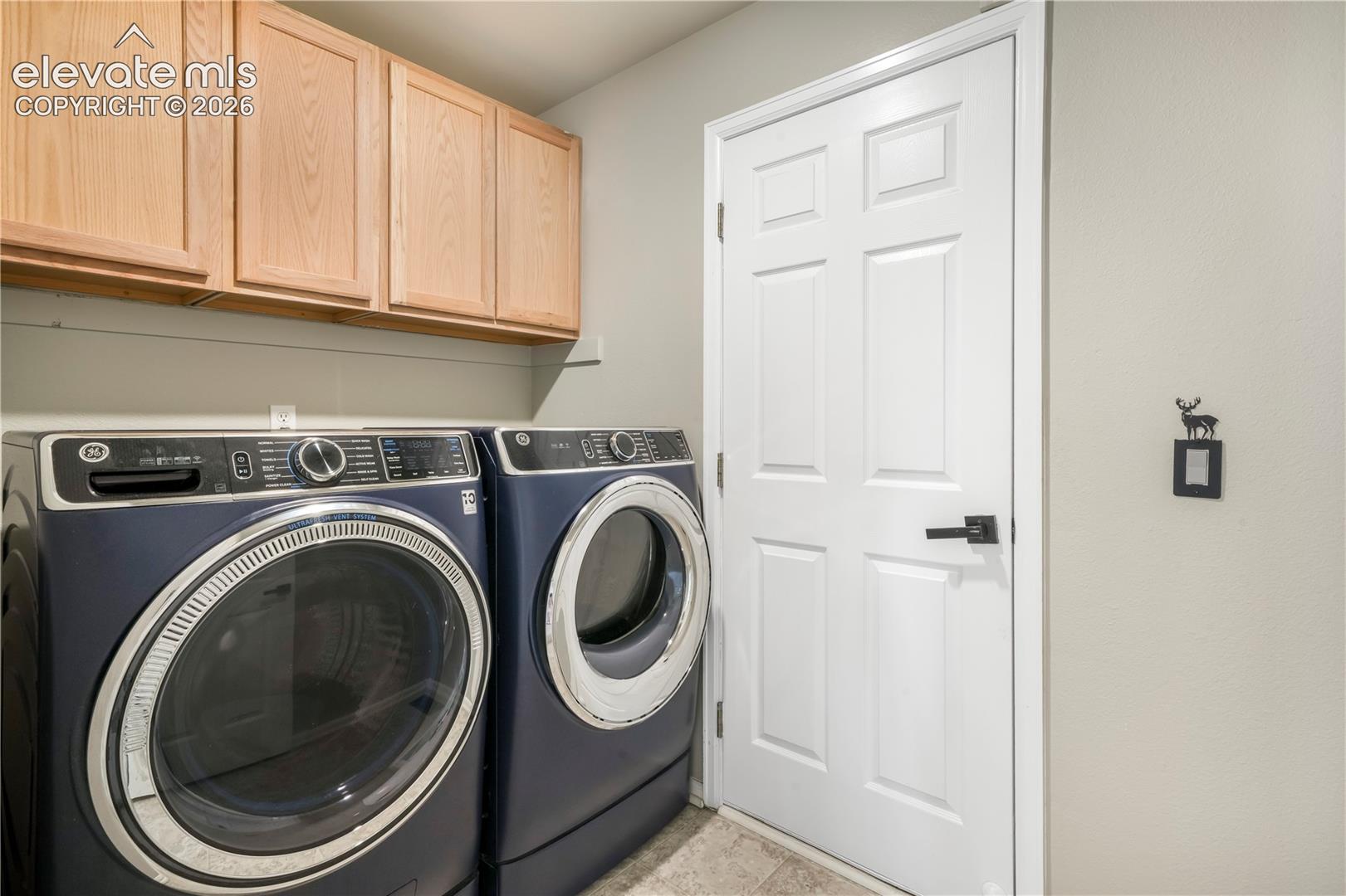 Main level laundry room with access to 2 car garage