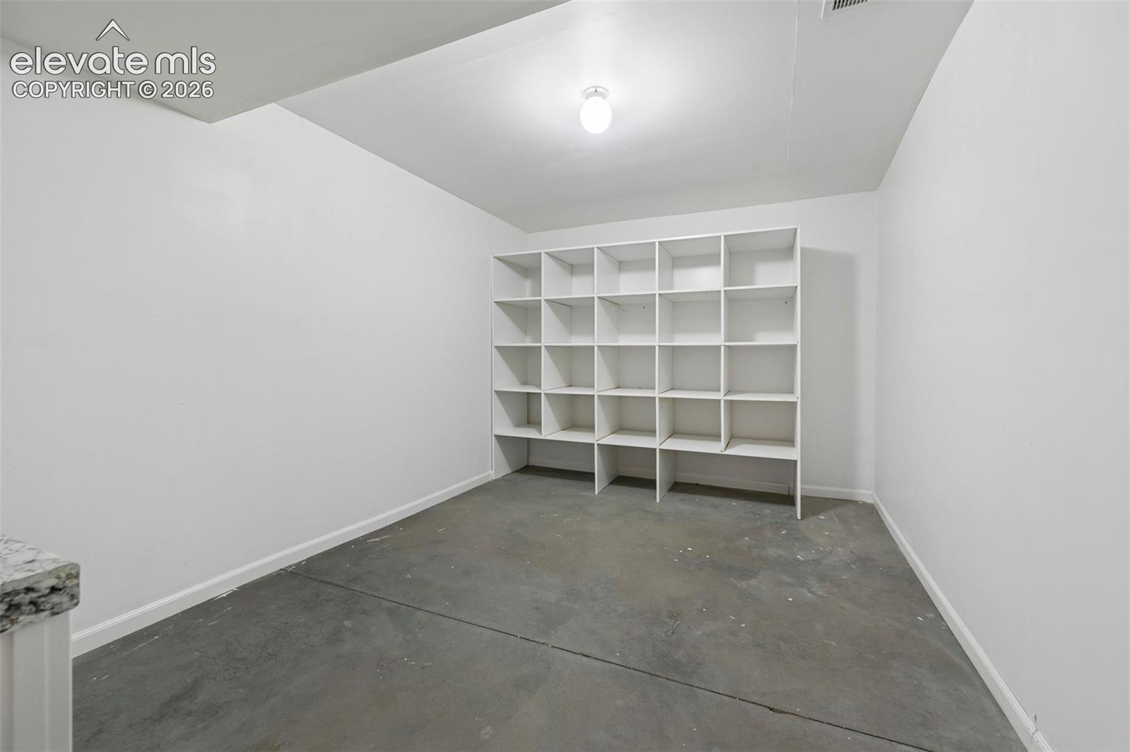 Basement storage room with built-in shelving