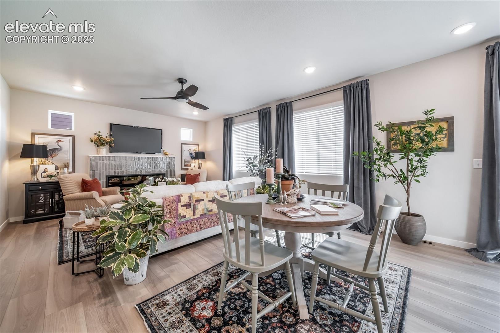 Open-concept living space featuring wood-finish flooring and recessed lighting
*Photos of a model home*