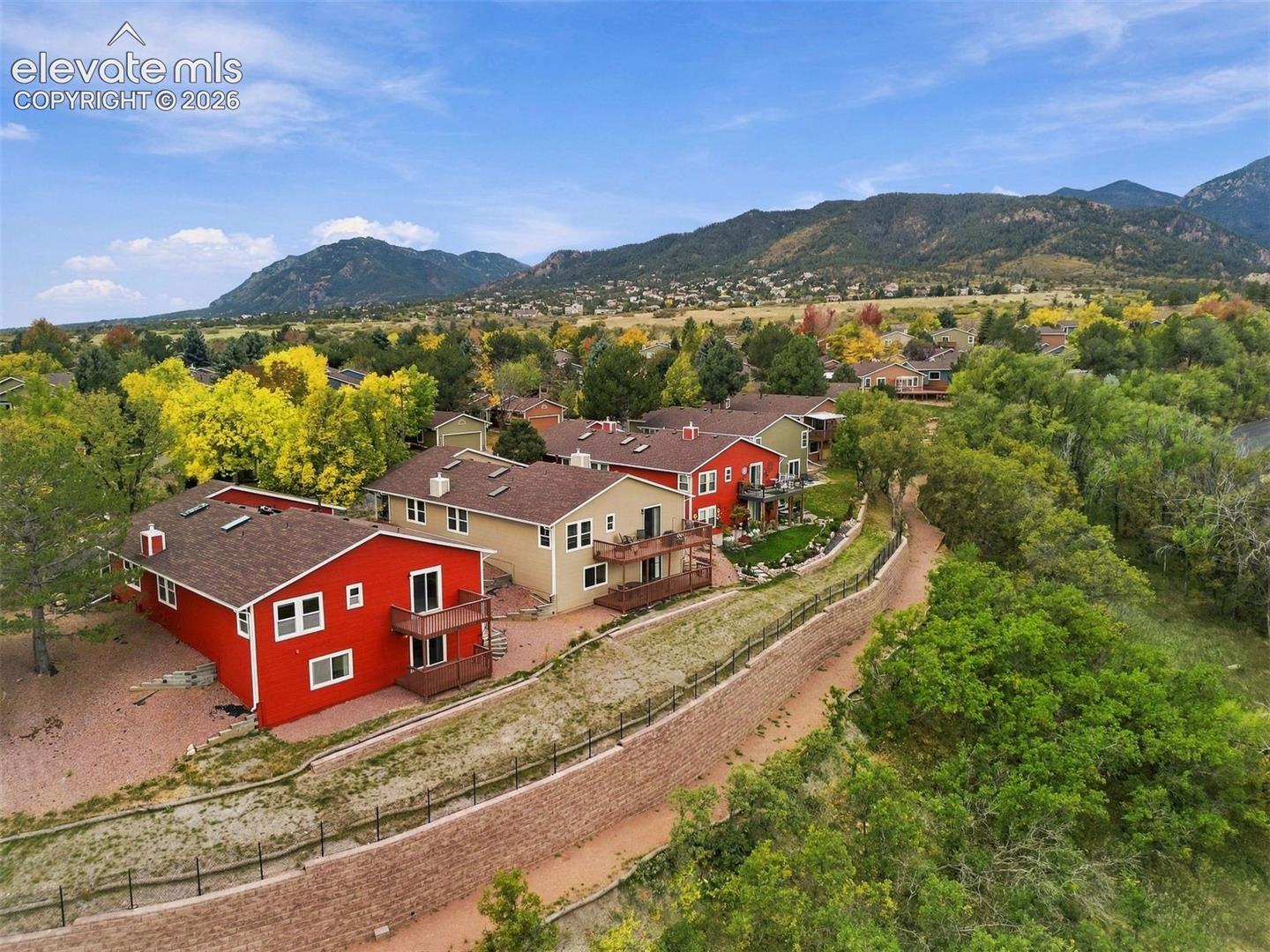 Back row of homes backing to HOA-owned open area. 