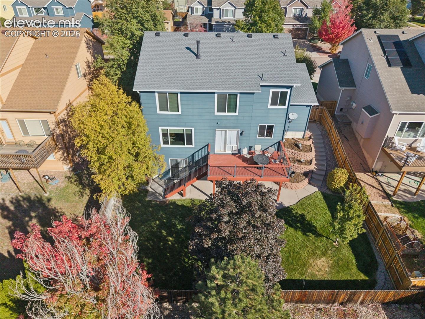 Aerial rear view with beautiful mature landscaping
