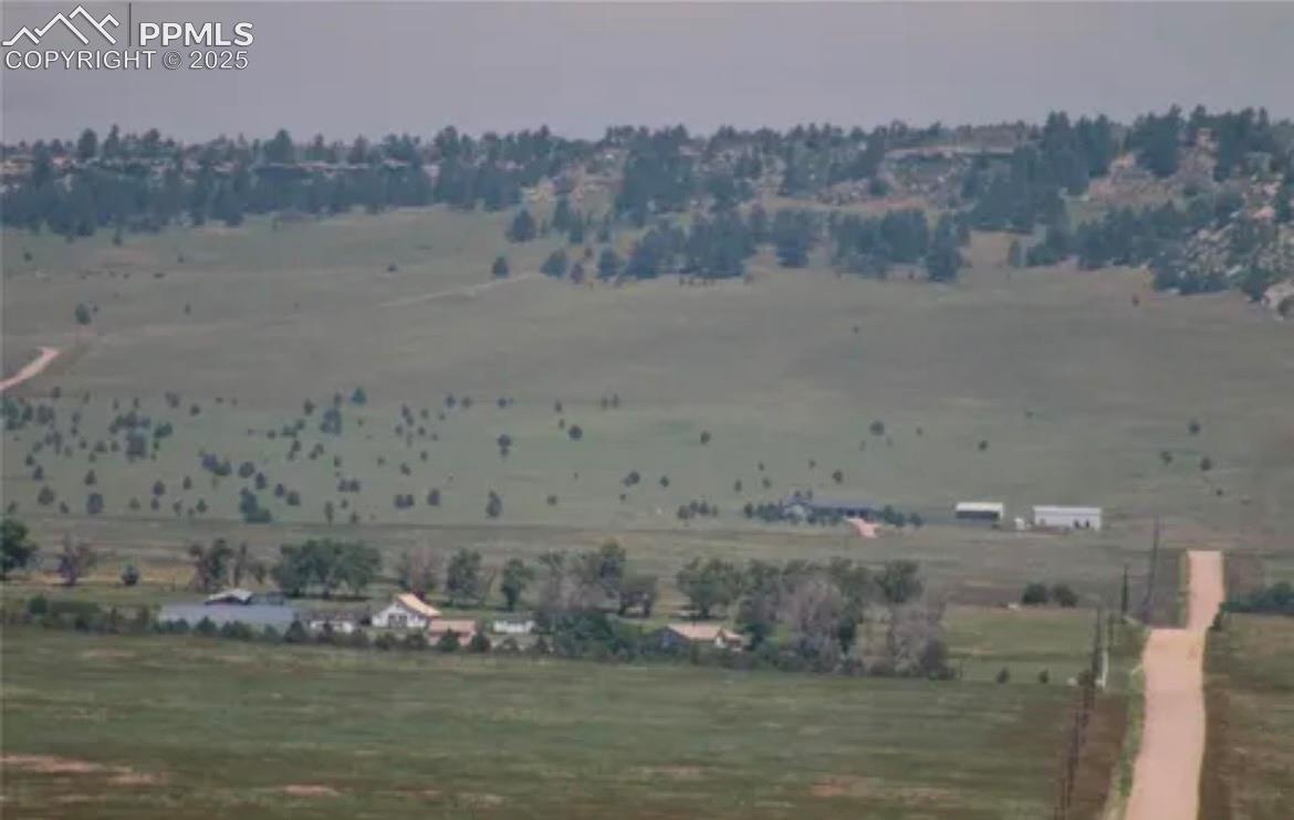 Property view of mountains with a rural view
