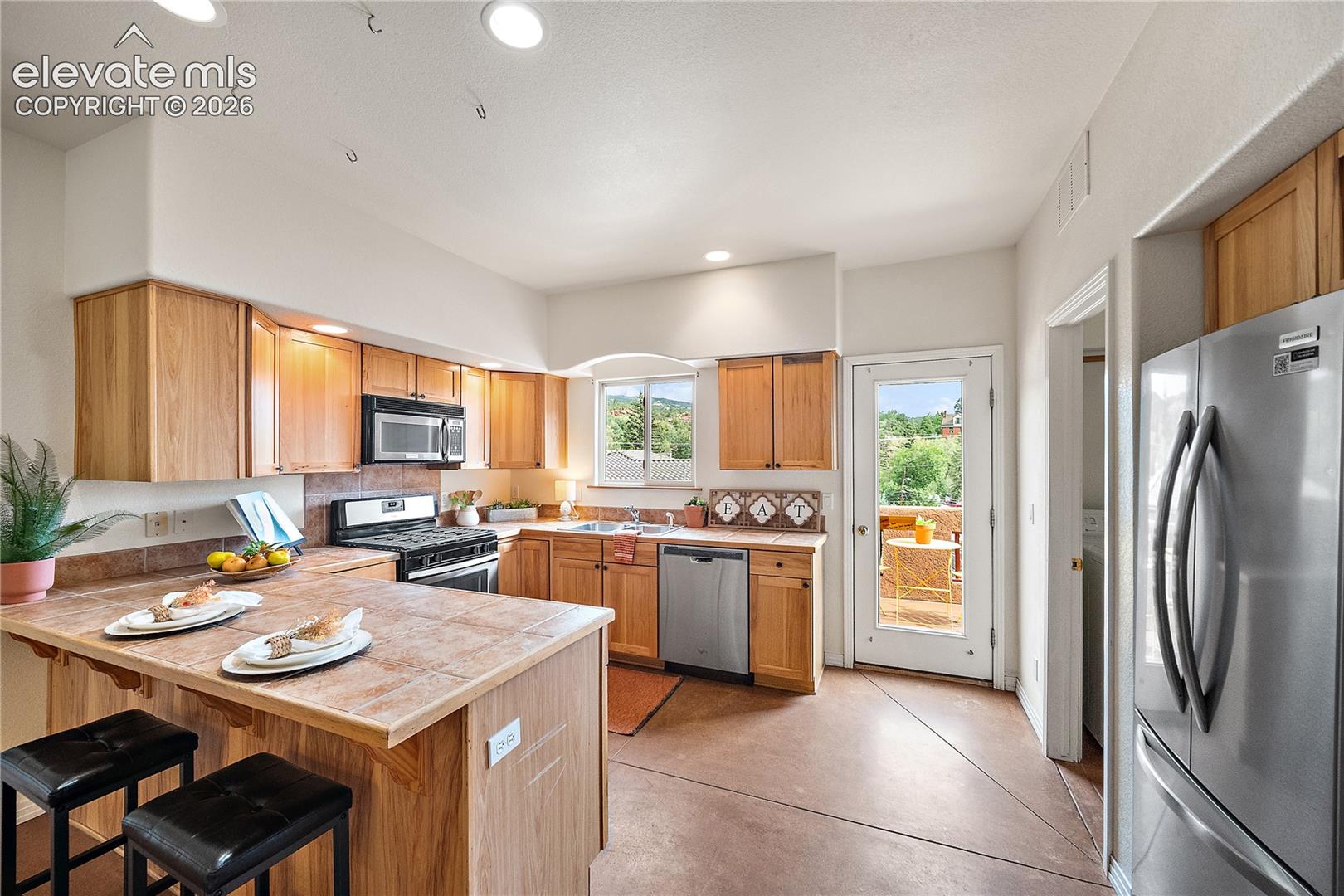 Kitchen walks out to balcony patio.