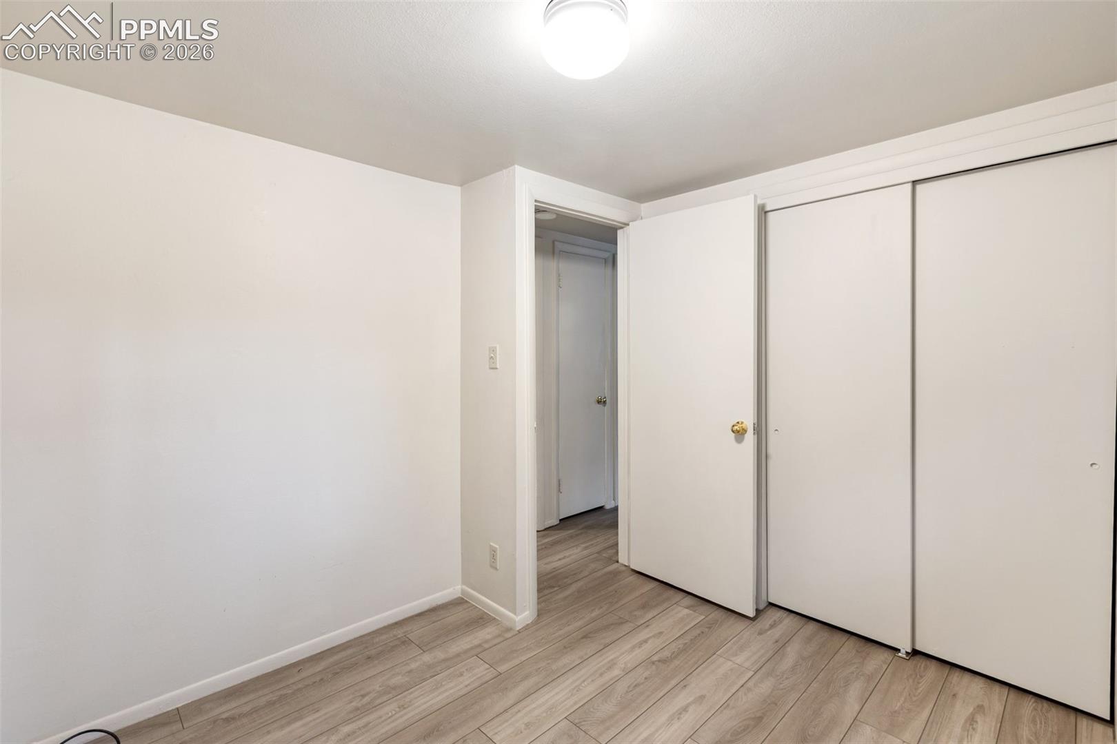 One of 2 bedrooms featuring LVP flooring