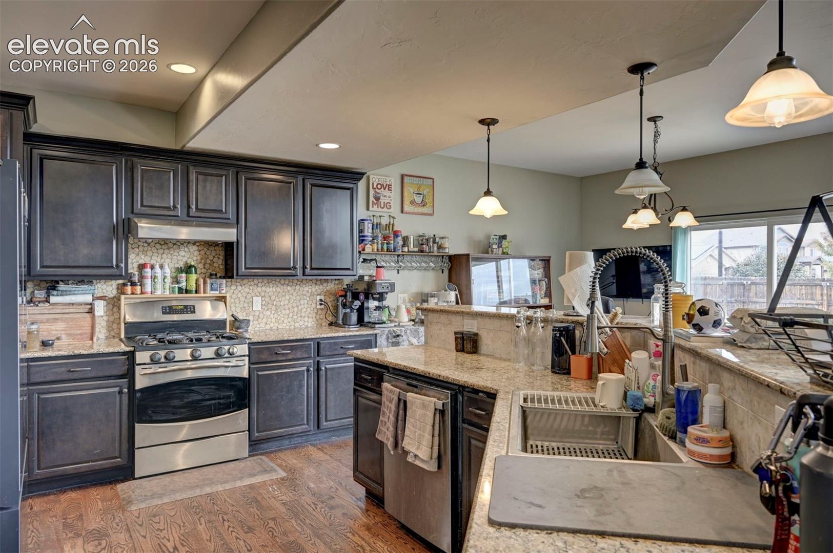 Kitchen: gas range, double oven and stainless appliances