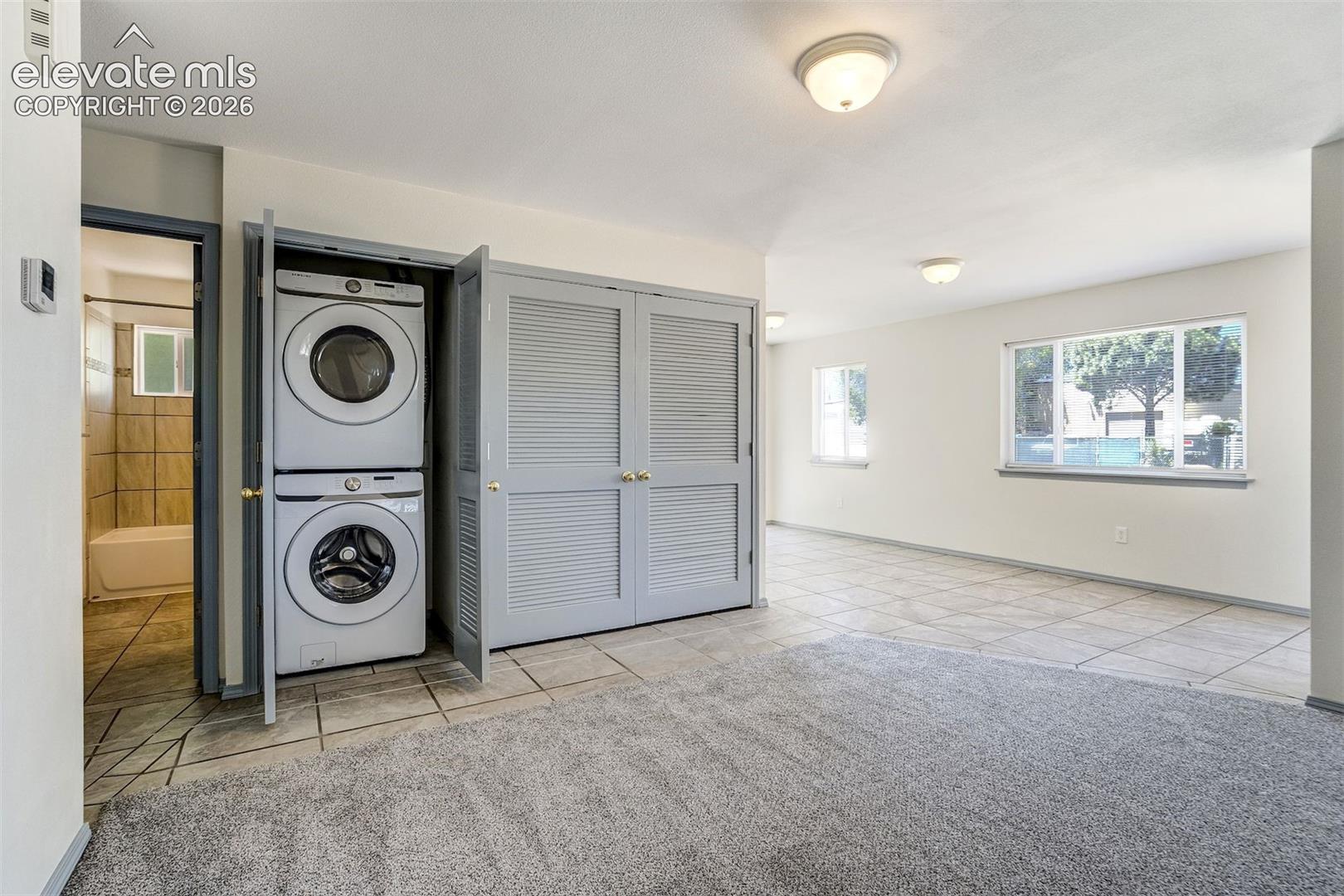 Stackable washer/dryer included.