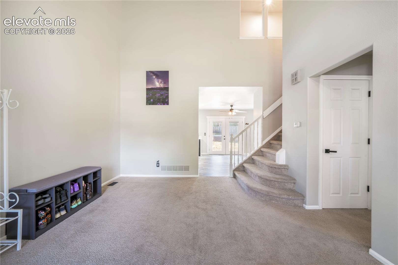 Front formal living room, access to main 1/2 bath, laundry, garage access and views into kitchen
