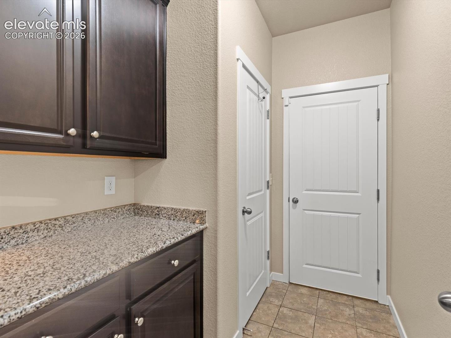 Mudroom off kitchen leads to garage
