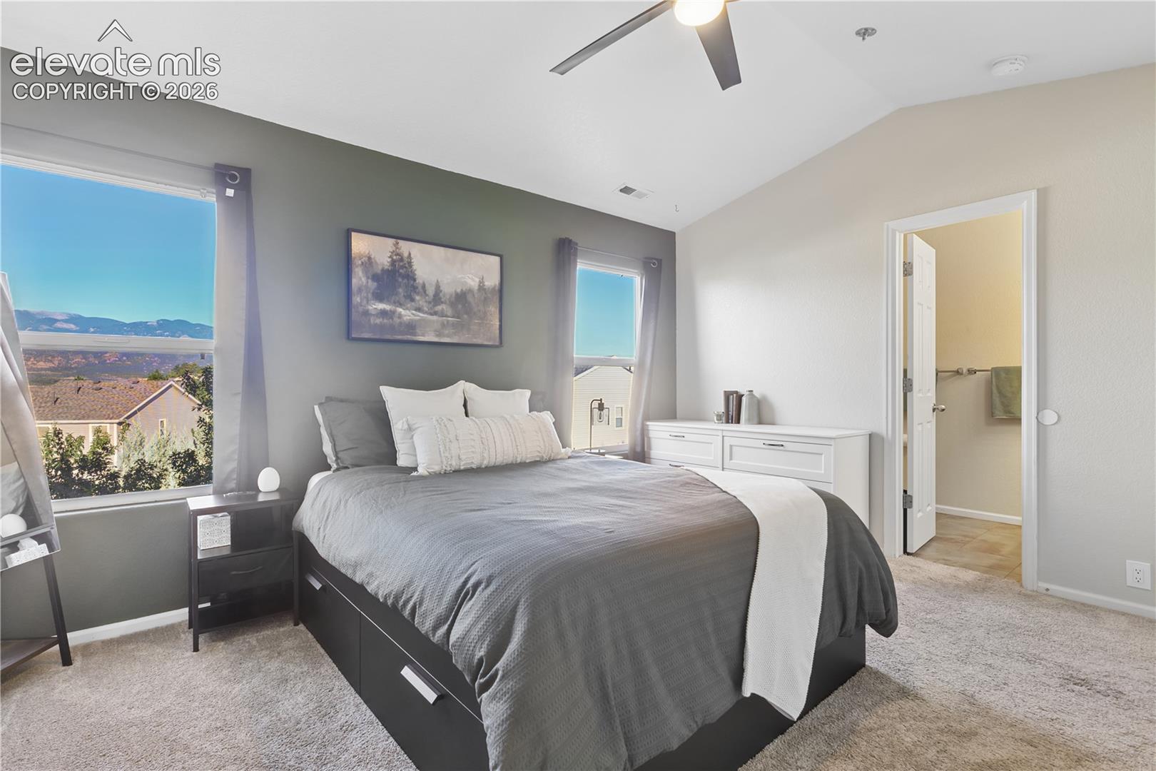 Large master bedroom with two closets and mountain views