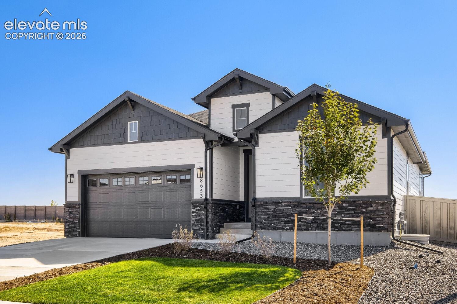 Modern exterior with white siding and dark grey accents
