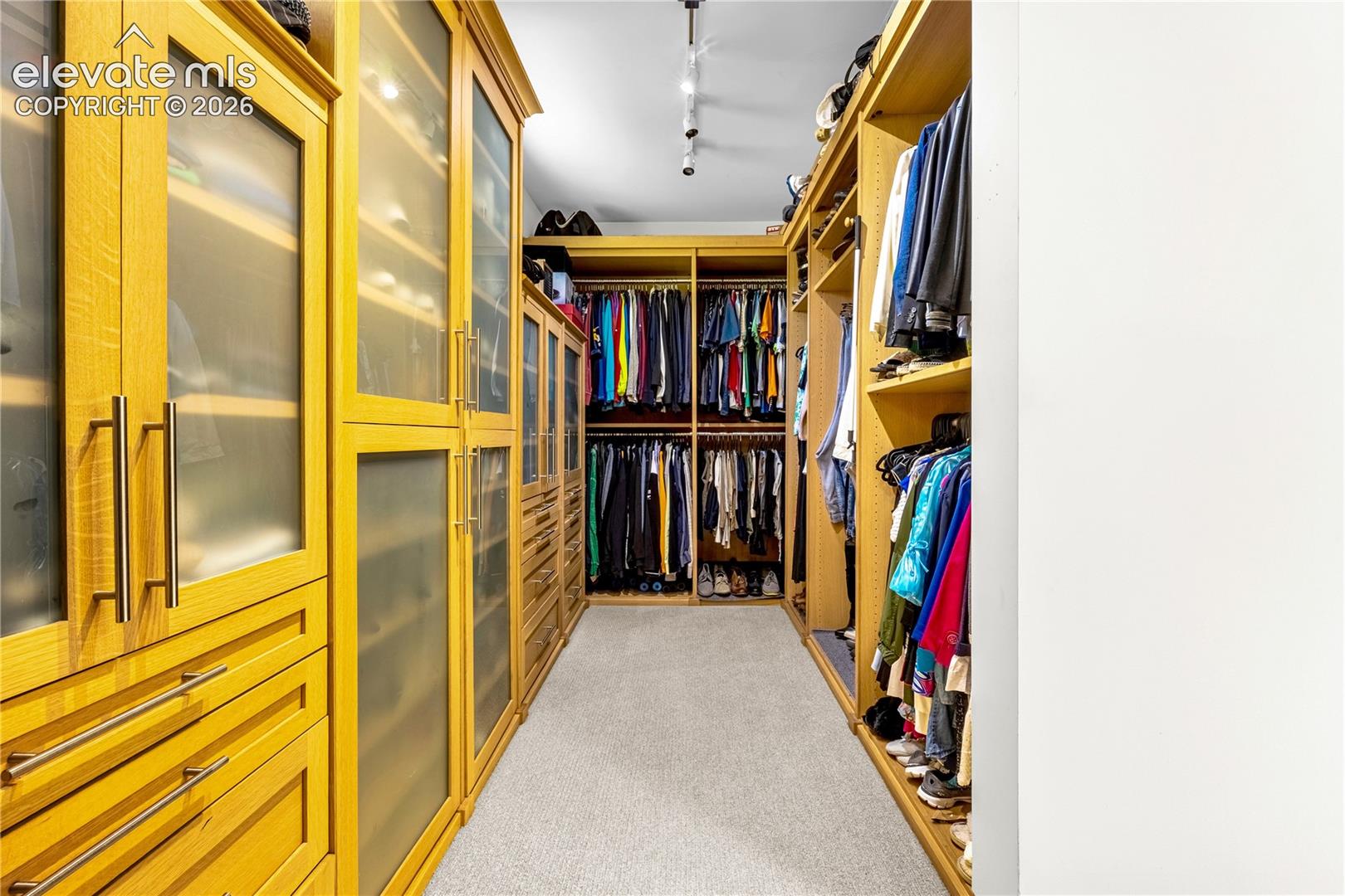 Walk-in primary closet with built-in organization