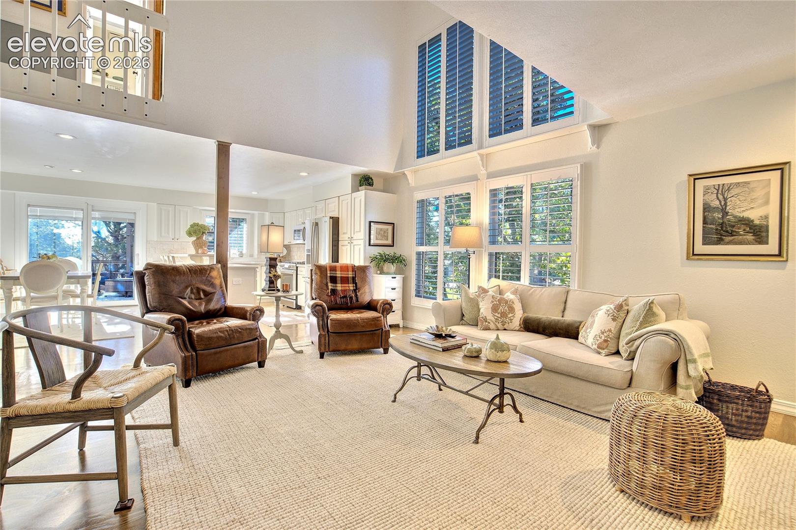 Soaring windows draw the towering pines into the room while filling the interior with natural light.