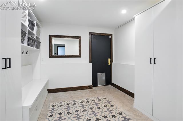 Mudroom featuring baseboards and recessed lighting