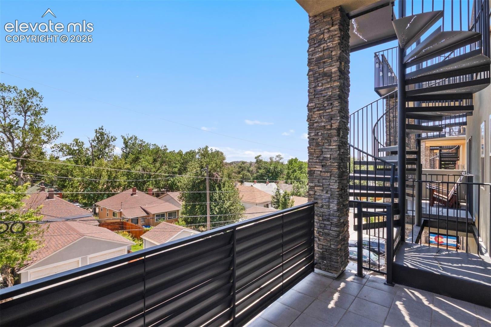 Front of home showcasing two private decks 