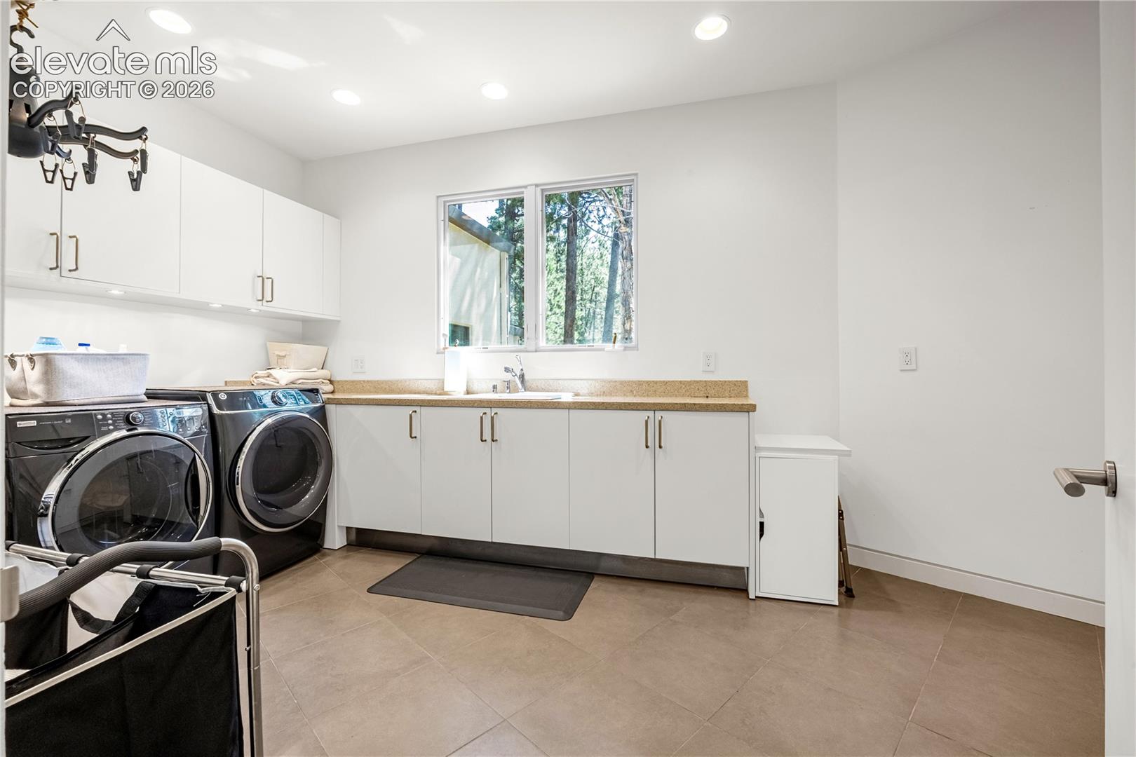 Laundry room adjacent to garage