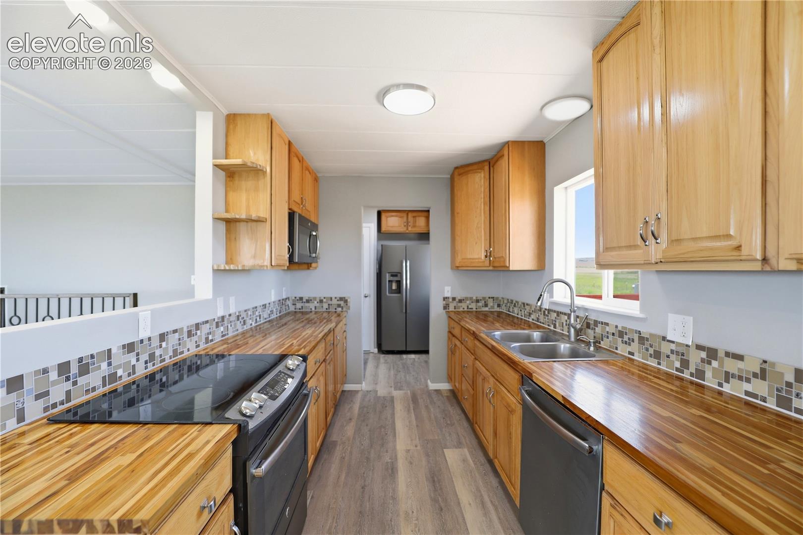 Butcher Block, Open Concept, Vinyl Plank, Mud Space Through Kitchen, Dining Room Sliding Door Off Kitchen