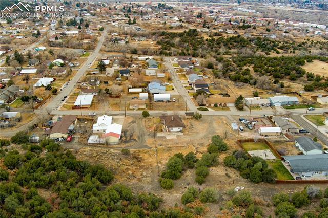 Aerial view of property's location with nearby suburban area