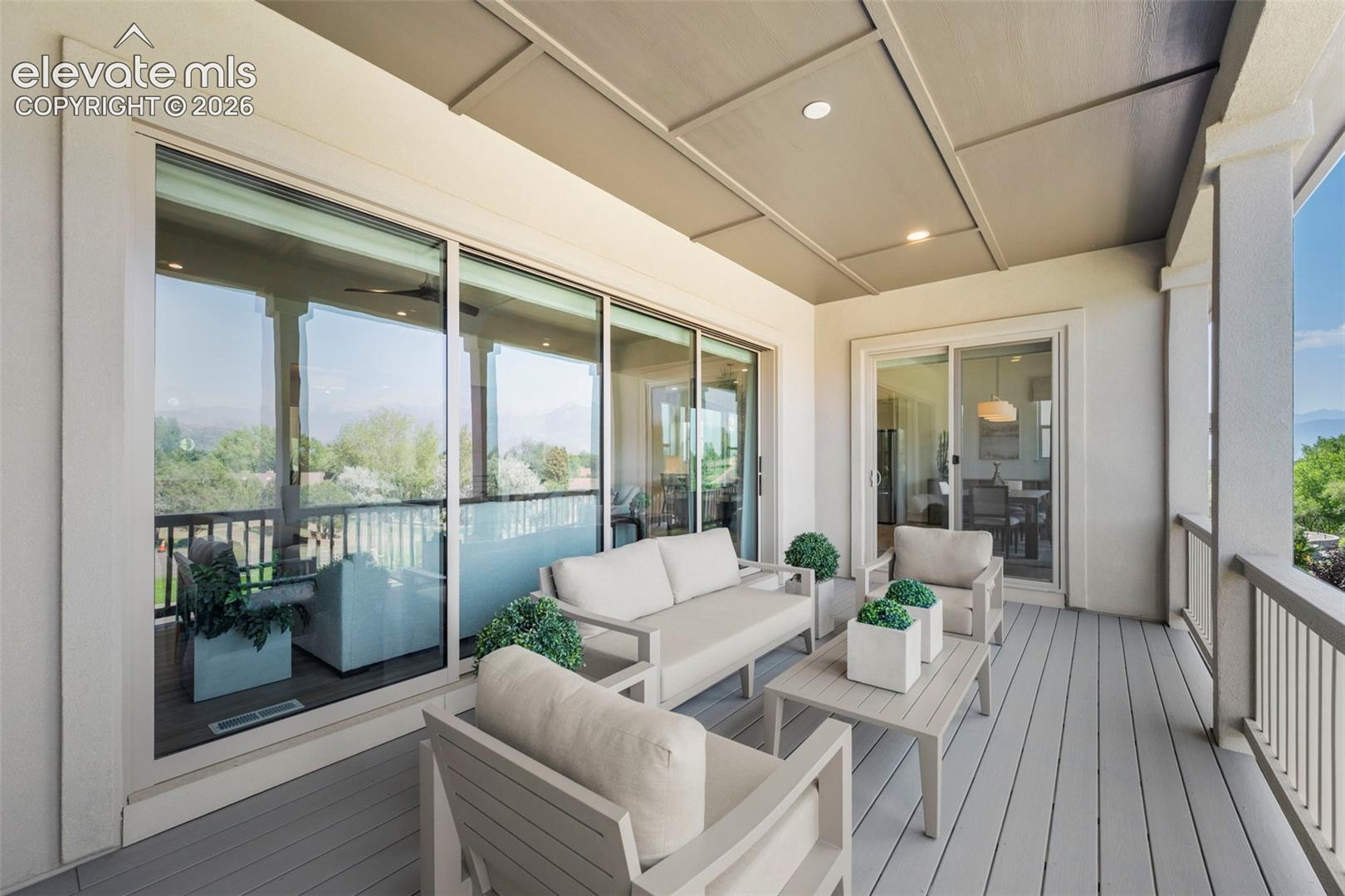 Covered outdoor deck with spectacular mountain and Pikes Peak views