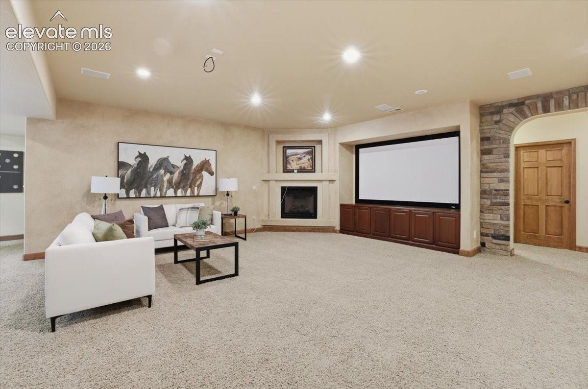 Family Room doubles as the Home Theater Room with speakers and screen ready to go! Gas Fireplace!