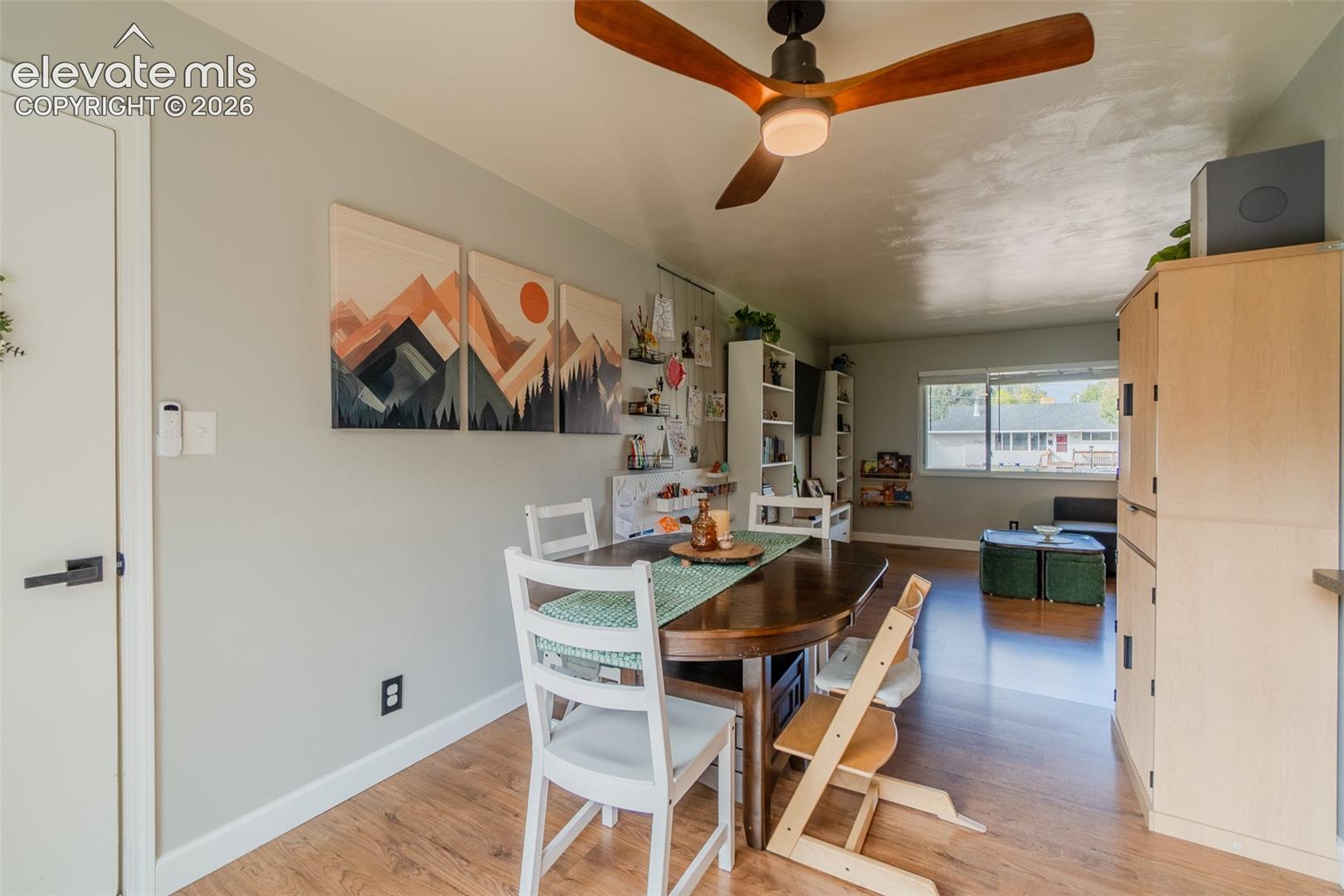 Wood-finish flooring, ceiling fan with integrated lighting, and horizontal sliding windows