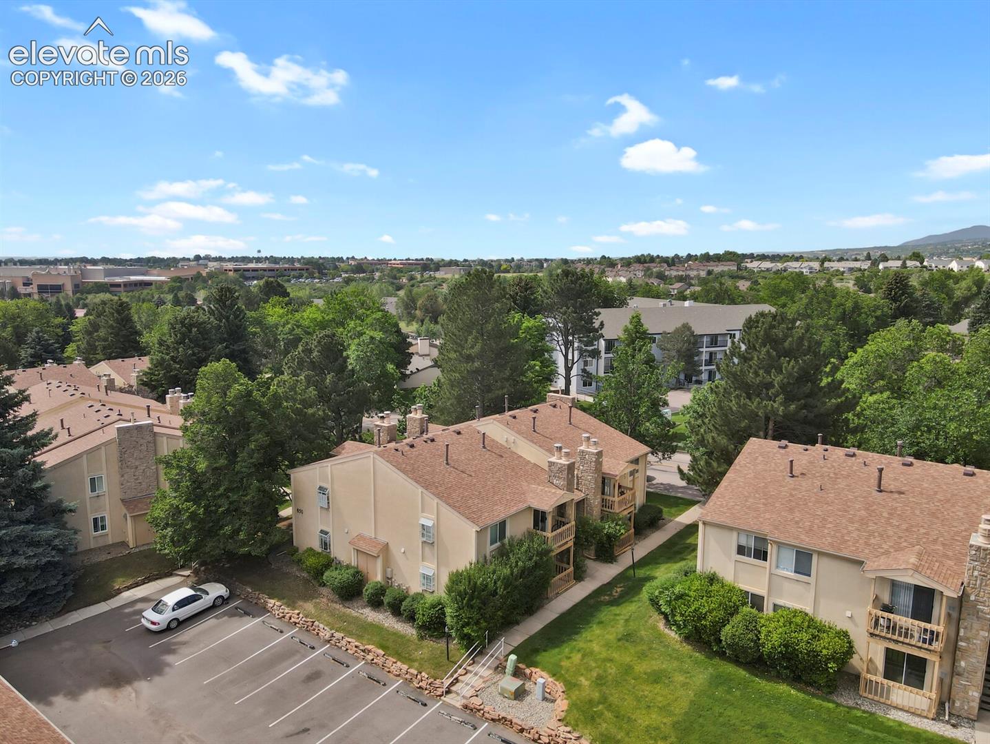 Aerial view of 850 in the center of this photo, showing the parking area and the steps and pathway that leads to the condo entrance and also leads out to Tenderfoot Hill Road, which provides some additional street parking if needed.
