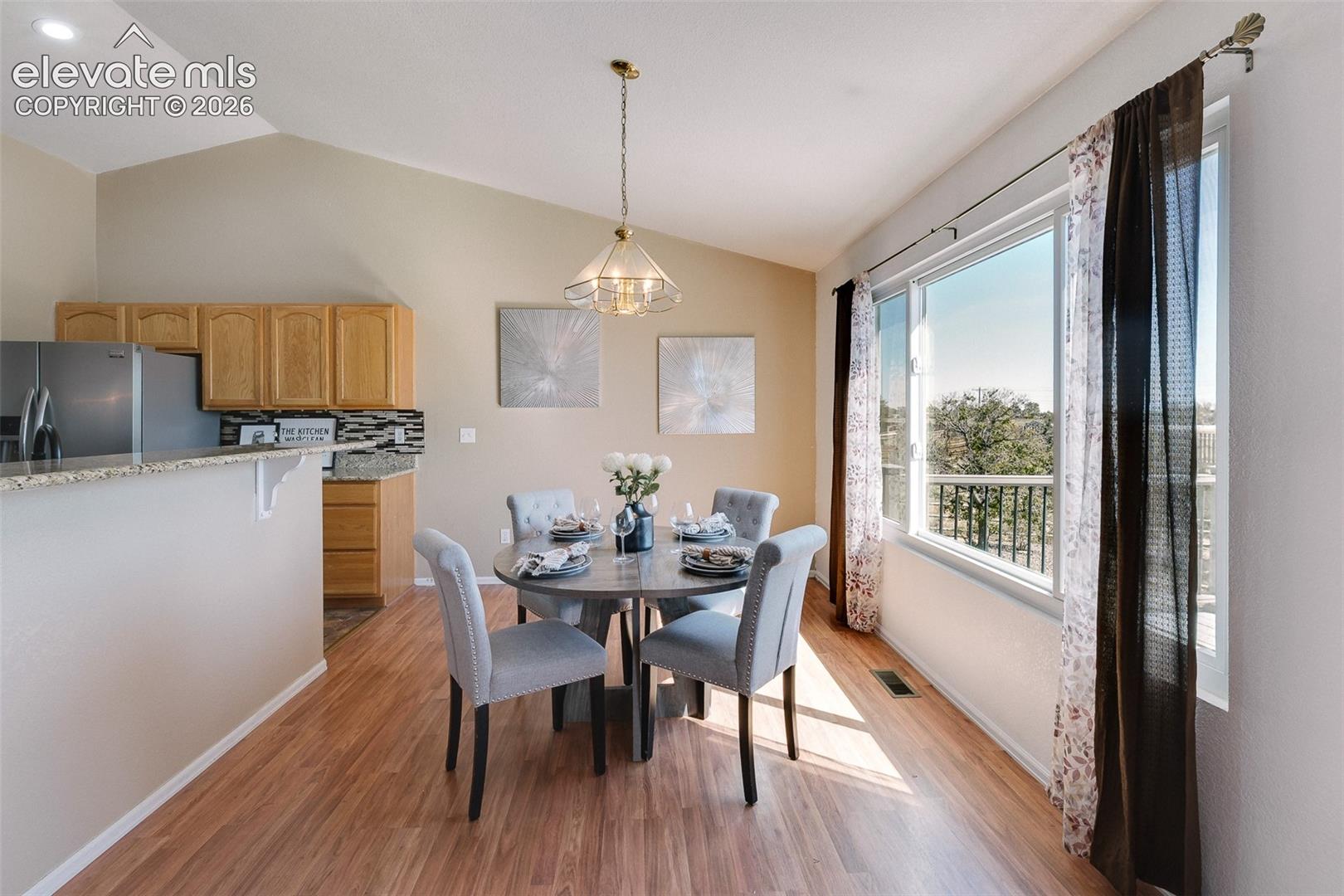 This dining area offers scenic views, abundant natural light, and plenty of room to host family and friends.