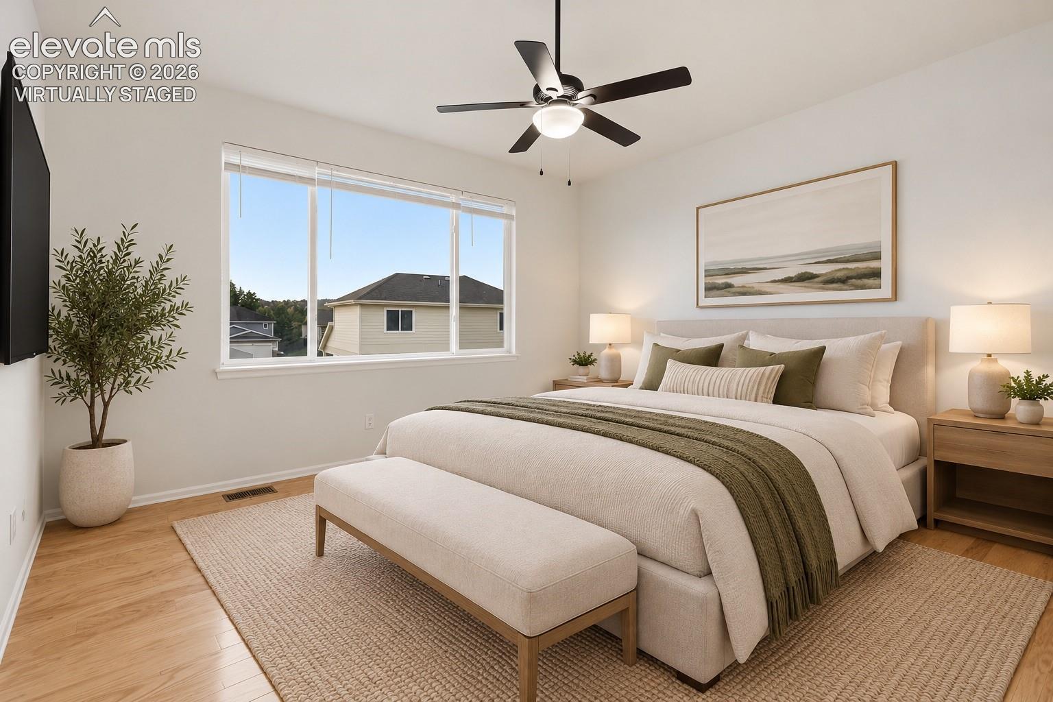 Primary Suite with Ceiling Fan, Pikes Peak Views and Wood Laminate flooring! Virtually Staged