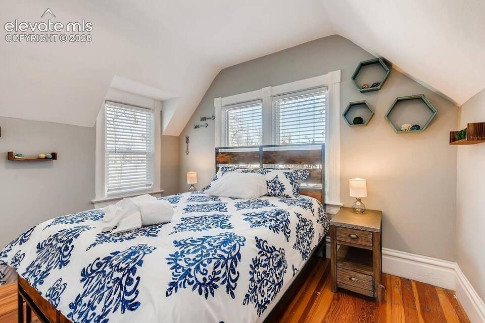 Second floor bedroom overlooks Bijou Street. Original wood floors, dormer window.