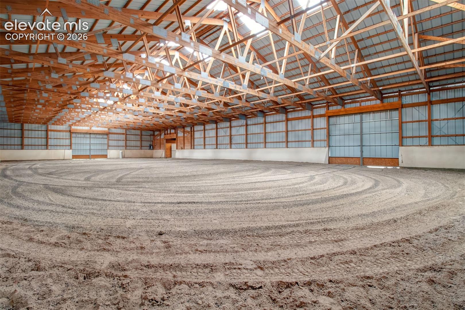 Indoor Arena, Two Sliding Access Doors, Barn Entrance is at the far right corner.