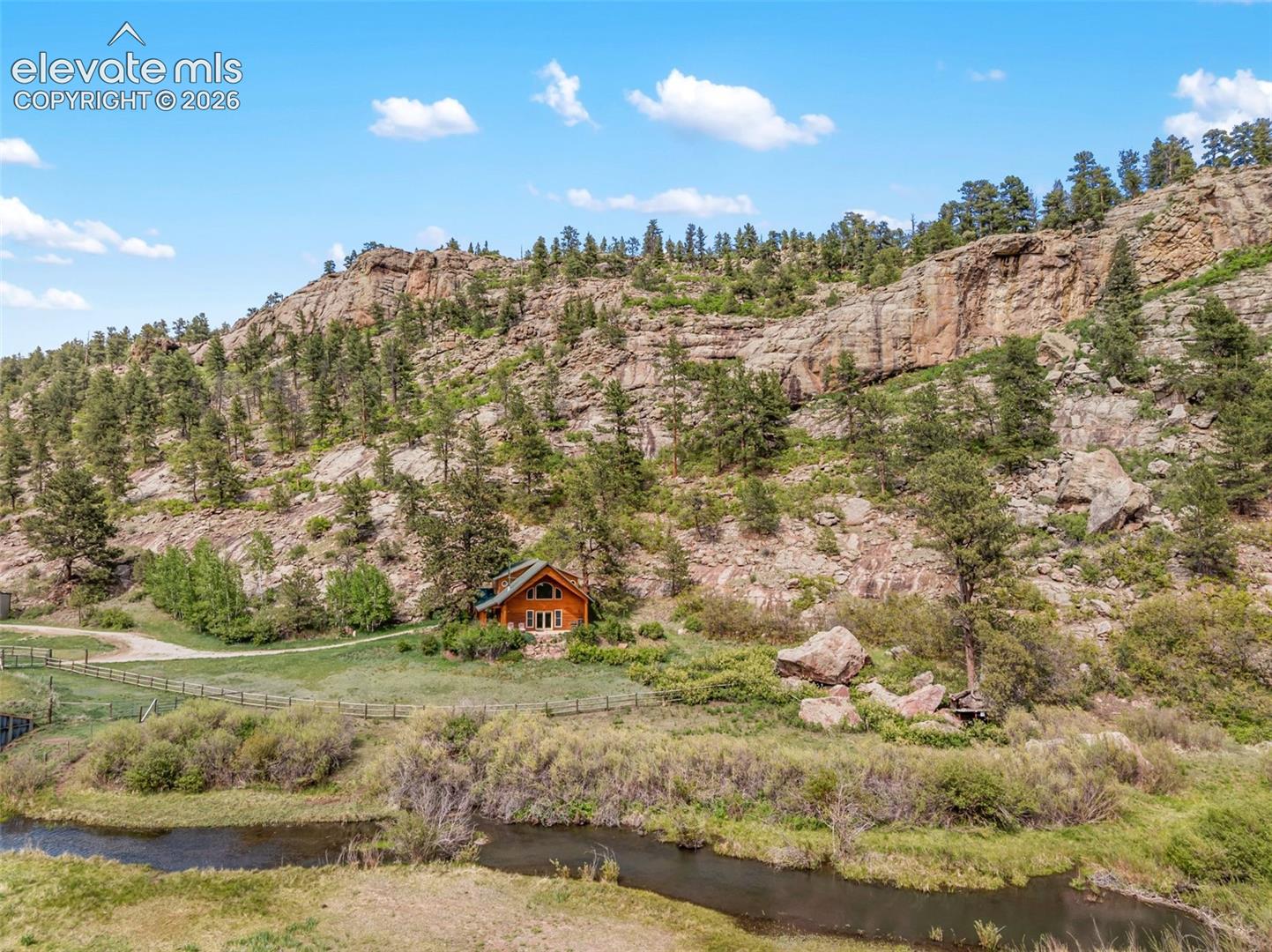 Beautiful rock formations, open pasture, and a tranquil stream surround your new home, creating a truly breathtaking setting.